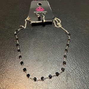 Short silver necklace with black gem stones